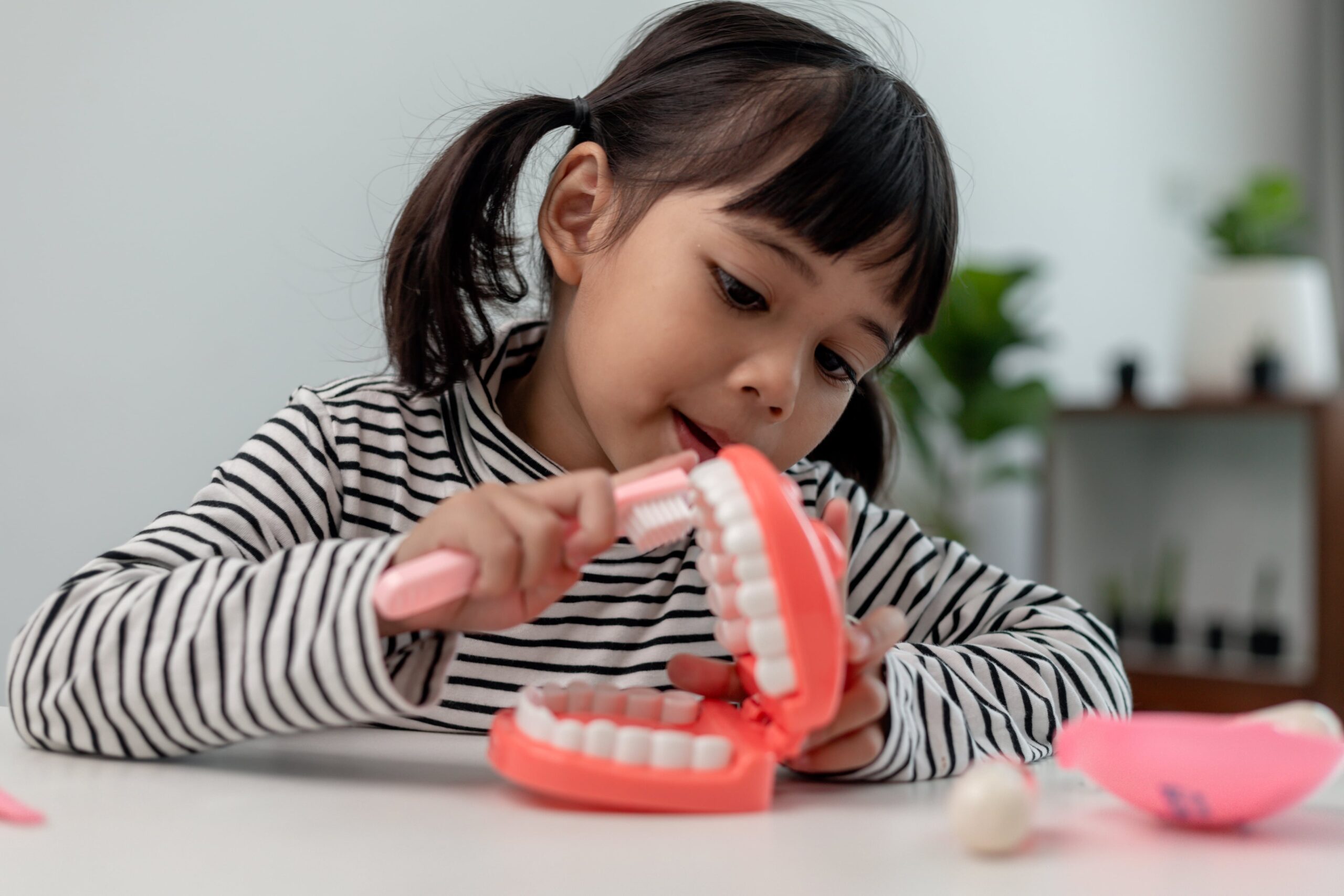 a-small-child-plays-with-artificial-jaws-children